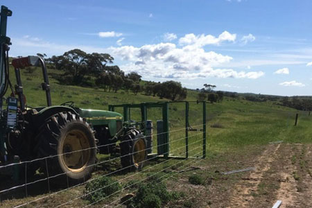 Farm fencing installation on agricultural land
